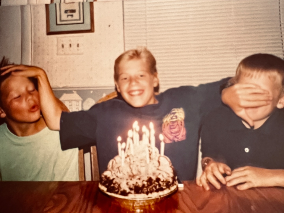 The Oyler brothers as kids, candid family moment with a birthday cake. The next generation that would carry the work forward.